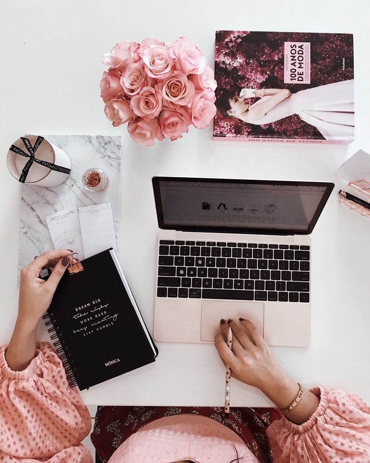 Aesthetic blogger workspace with laptop, notebook, coffee mug, and fashion moodboard showing creative planning and inspiration for starting a fashion blog.